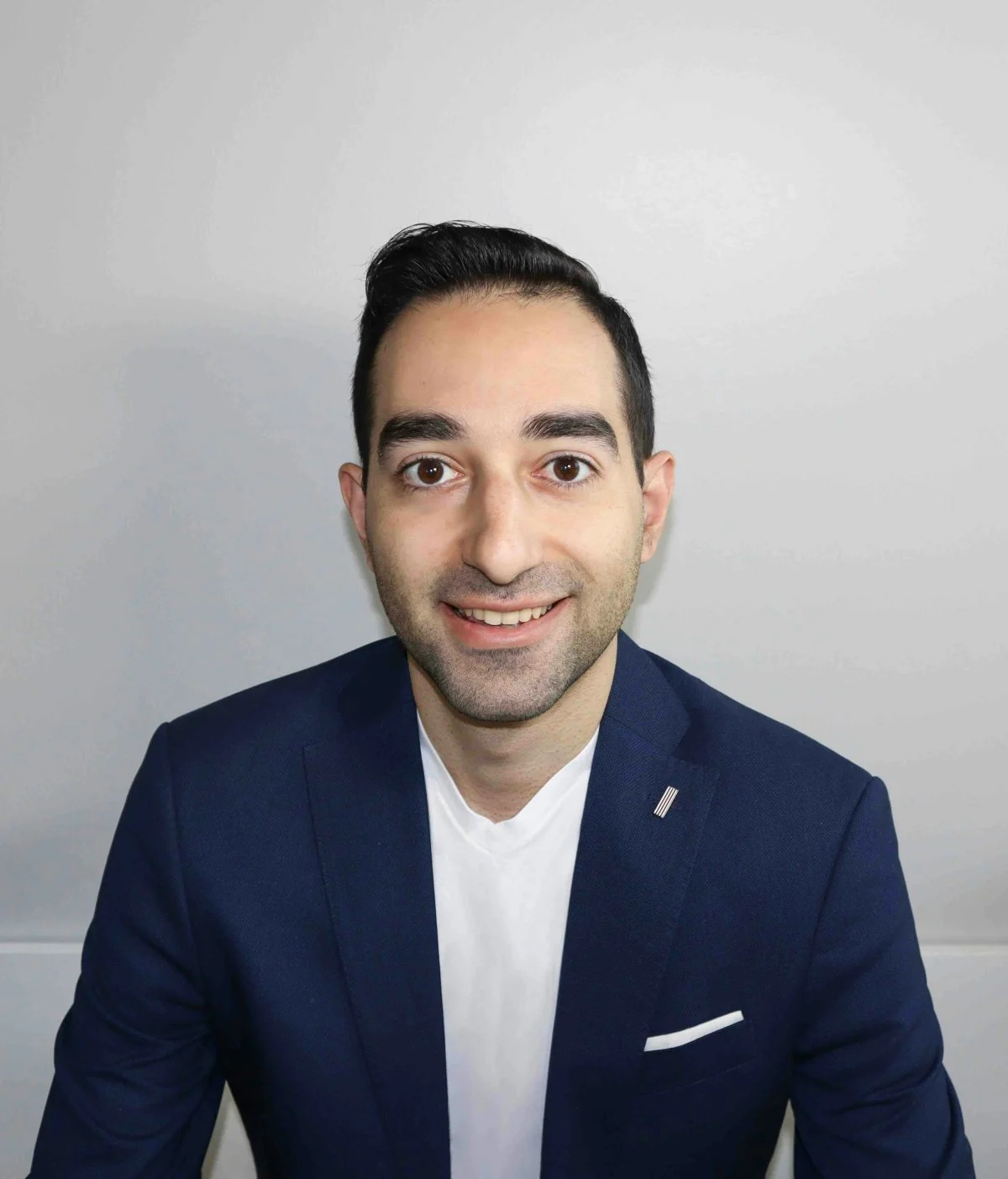 blazer coat jacket face head photography portrait smile suit dimples