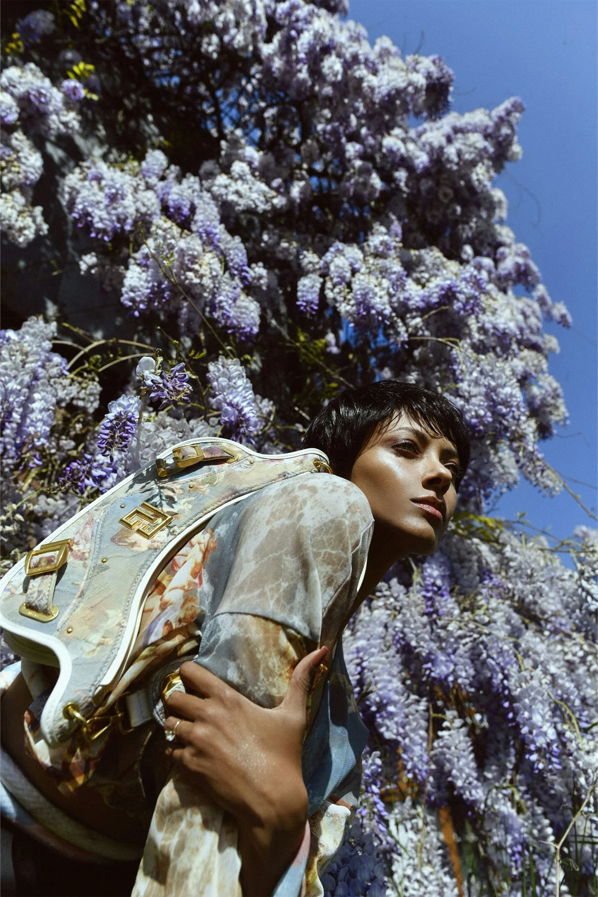 flower finger person fashion face head smile handbag formal wear flower arrangement