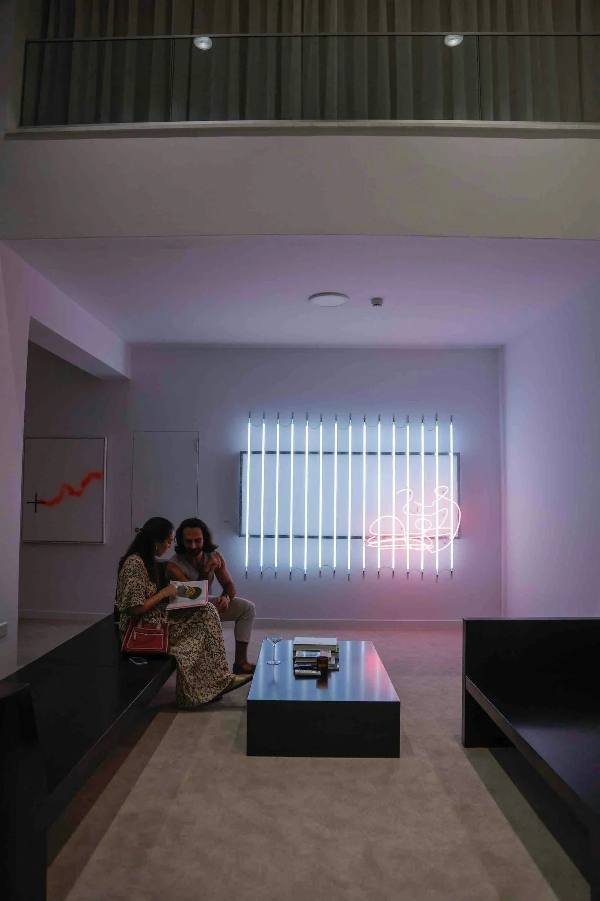 furniture indoors living room floor coffee table table flooring couch home decor person