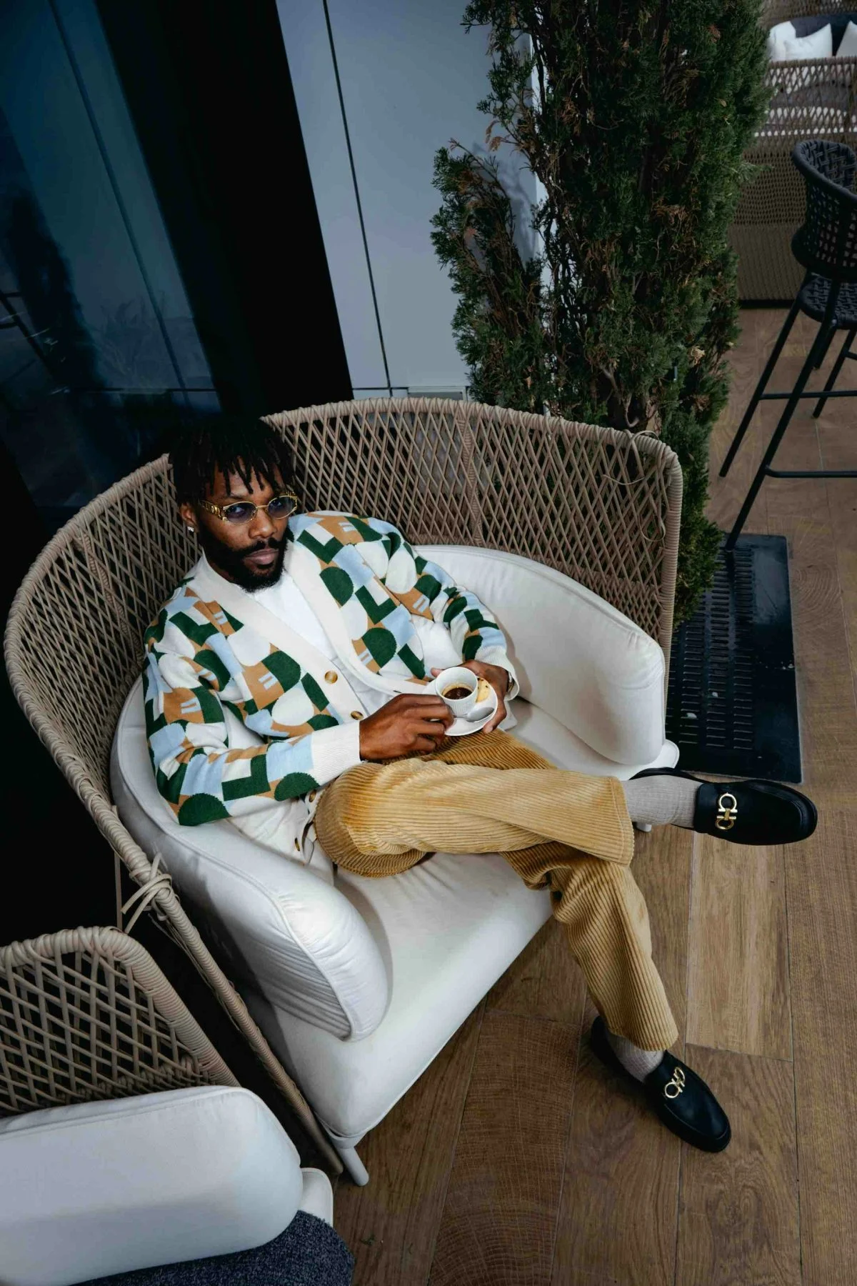 person sitting adult male man furniture