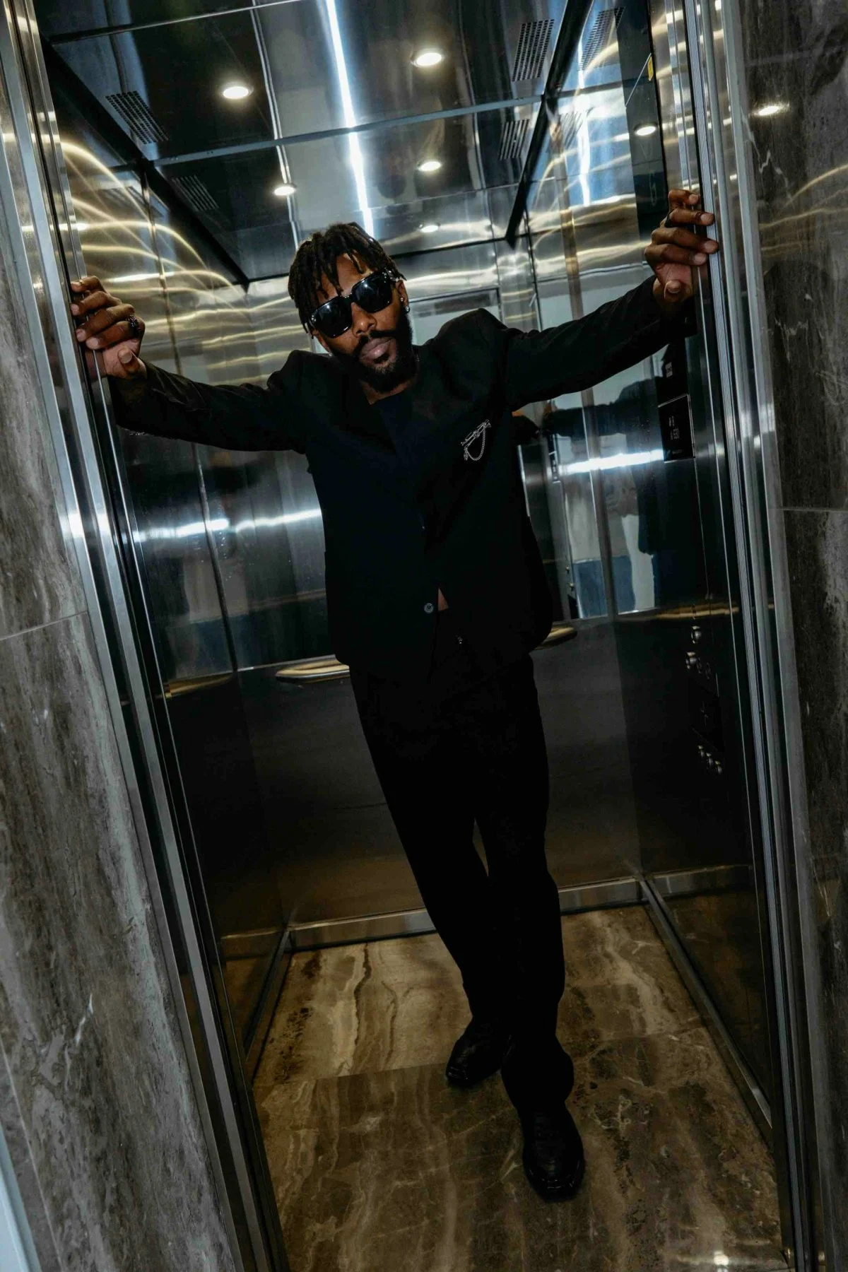 indoors adult male man person elevator