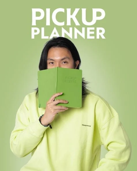 person reading adult female woman clothing coat publication book