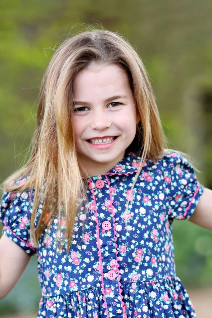 Princess Charlotte wearing a blue and pink floral dress