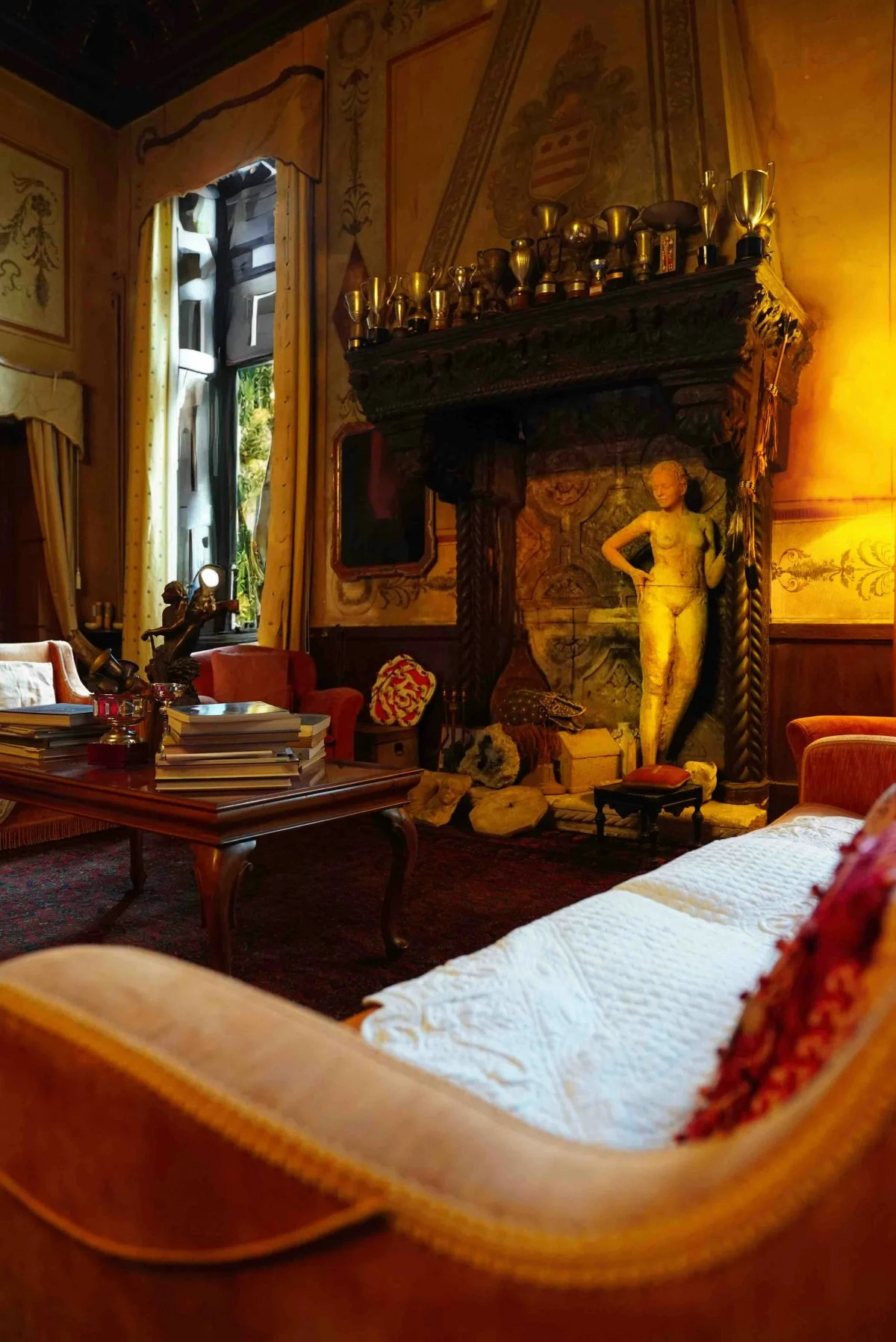 building furniture indoors living room room fireplace couch interior design home decor person