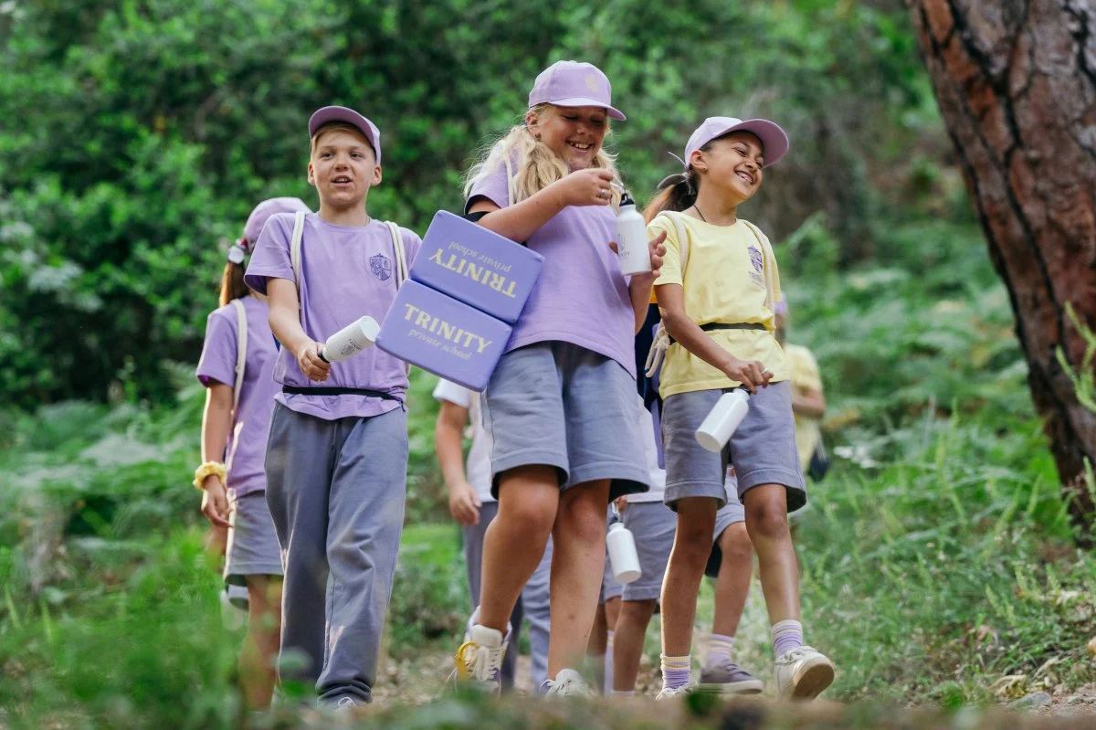 shorts person walking shoe vegetation people hat box bracelet hiking