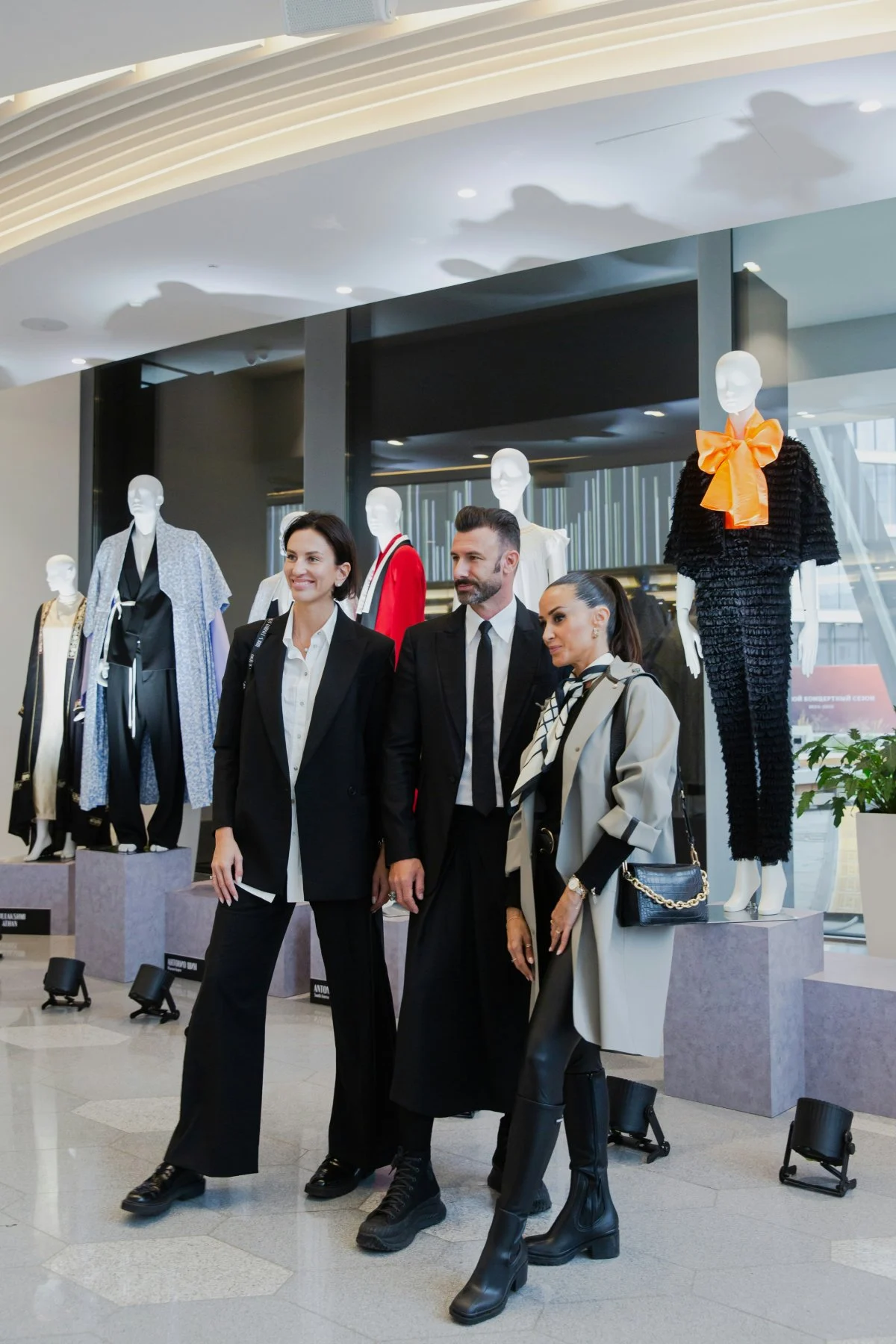 coat handbag adult female person woman male man shoe high heel